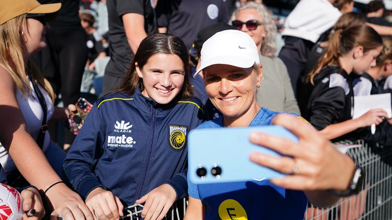 England&#39;s Sarina Wiegman takes photos with fans after a training session at Central Coast Stadium in Gosford, New South Wales. Picture date: Tuesday July 25, 2023. PA Photo. See PA story WORLDCUP England. Photo credit should read: Zac Goodwin/PA Wire. ..RESTRICTIONS: Use subject to restrictions. Editorial use only, no commercial use without prior consent from rights holder.