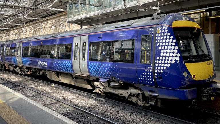 A ScotRail train waiting at the platform at Edinburgh&#39;s Waverley Station. ScotRail&#39;s new timetable, which will see almost 700 fewer train services a day across Scotland, begins today whilst the deadlock over driver pay continues. Picture date: Monday May 23, 2022.
