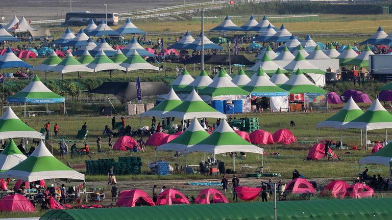 Attendees of the World Scout Jamboree prepare to leave a scout camping site in Buan, South Korea, Tuesday, Aug. 8, 2023. South Korea will evacuate tens of thousands of scouts by bus from a coastal jamboree site as Tropical Storm Khanun looms, officials said Monday. (Kim Myung-nyeon/Newsis via AP)