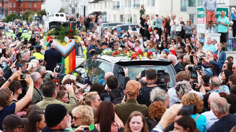 Fans of singer Sinead O&#39;Connor line the streets for a &#34;last goodbye&#34; to the Irish singer as her funeral cortege passes through her former hometown of Bray, Co Wicklow, ahead of a private burial service 