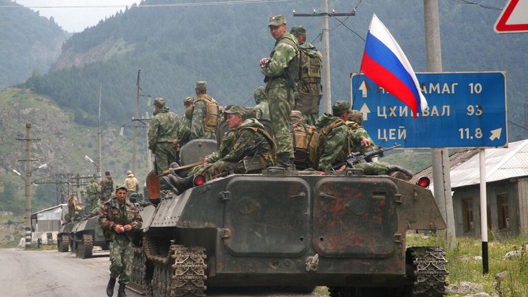 FILE -- In this Friday Aug. 8, 2008 file photo, a column of Russian armored vehicles move through North Ossetia towards the breakaway republic of South Ossetia&#39;s capital Tskhinvali.