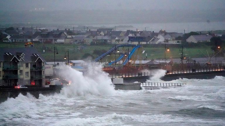 Waves crash against the sea wall in Tramore, County Waterford, during Storm Betty