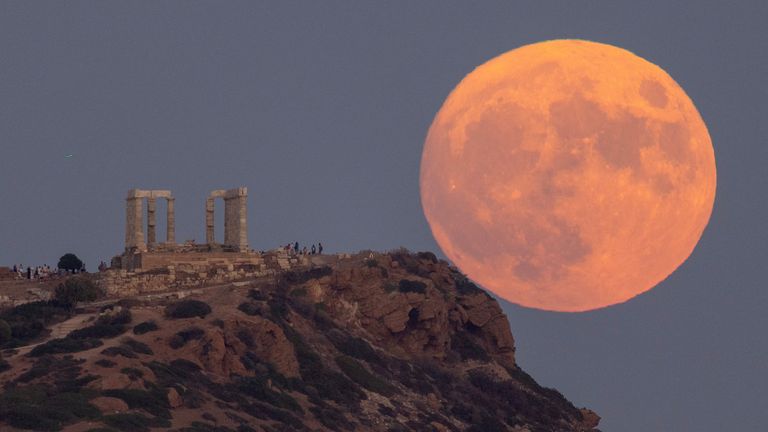 The super blue moon behind Temple of Poseidon near Athens, Greece