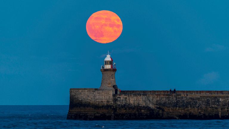 The super blue moon over the South Shields Pier Lighthouse in Newcastle. Pic: AP