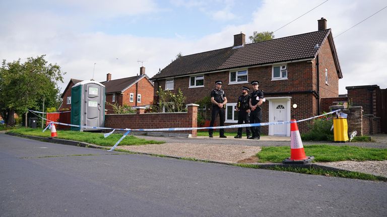 Surrey Police officers outside a property on Hammond Road in Woking, Surrey, where a 10-year-old girl was found dead after officers were called to the address on Thursday following a concern for safety. Picture date: Friday August 11, 2023. PA Photo. See PA story POLICE Woking. Photo credit should read: Jonathan Brady/PA Wire