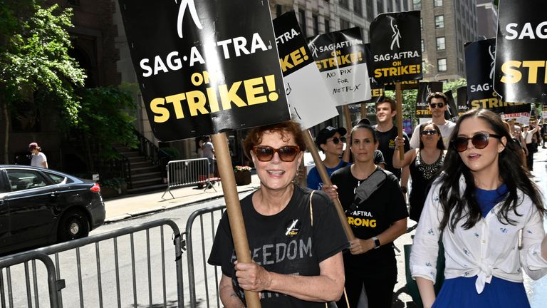 Actor Susan Sarandon carries a sign on the picket line outside Netflix on Friday, July 21, 2023, in New York. The actors strike comes more than two months after screenwriters began striking in their bid to get better pay and working conditions. (Photo by Evan Agostini/Invision/AP)