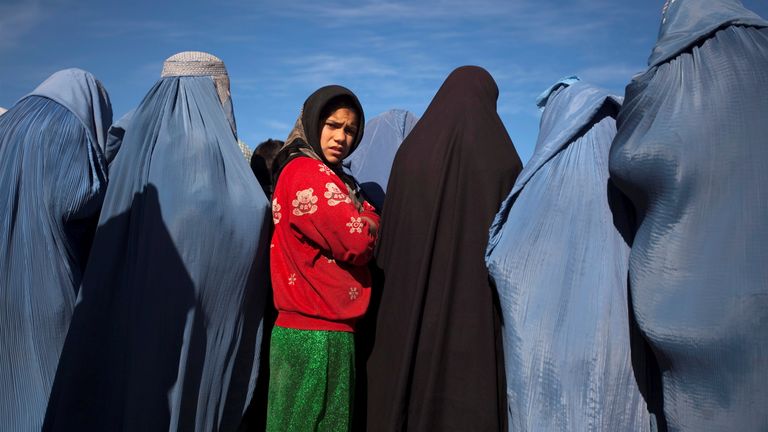 People walk in a street in Kabul, Afghanistan, November 9, 2022. REUTERS/Ali Khara