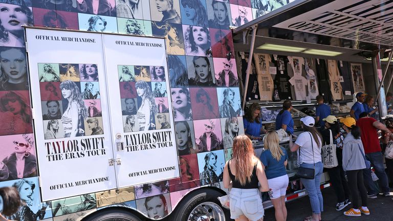 Taylor Swift fans buy concert merchandise outside Levi&#39;s Stadium in Santa Clara, Calif., on Thursday, July 27, 2023. (Scott Strazzante/San Francisco Chronicle via AP)