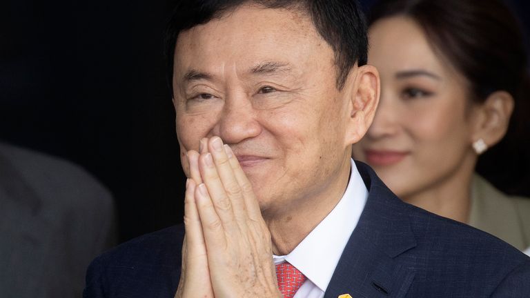 Thailand's former Prime Minister Thaksin Shinawatra greets his supporters upon his arrival at Don Muang Airport in Bangkok, Thailand, Tuesday, August 22, 2023. (AP Photo/Wason Wanichakorn)