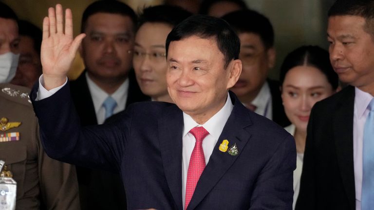 Thailand&#39;s former Prime Minister Thaksin Shinawatra, center, arrives at Don Muang airport in Bangkok, Thailand, Tuesday, Aug. 22, 2023. (AP Photo/Sakchai Lalit)