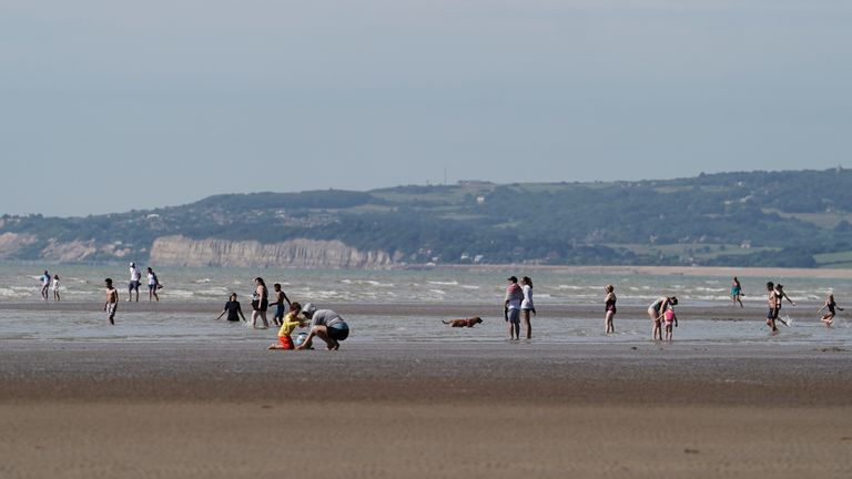 People enjoy the warm weather at Camber Sands in East Sussex. Picture date: Thursday August 10, 2023.