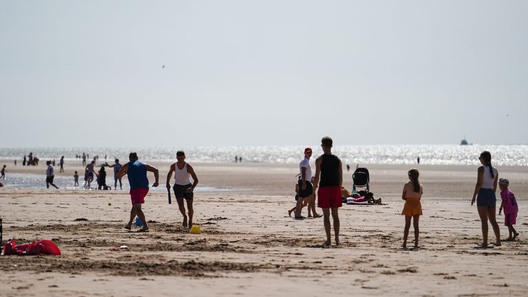 People enjoy the warm weather at Camber Sands in East Sussex. Picture date: Thursday August 10, 2023.