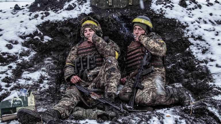 Ukrainian soldiers in their foxhole defending the north of the city of Kharkiv on the second day of the war. Pic: Julian Simmonds