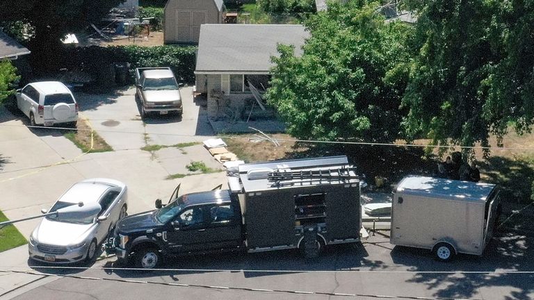 Law enforcement investigate the scene of a shooting involving the FBI in Provo, Utah, on Wednesday, Aug. 9, 2023. A Utah man accused of making violent threats against President Joe Biden was shot and killed by FBI agents hours before the president was expected to land in the state Wednesday, authorities say. The shooting happened around 6:15 a.m. as special agents tried to serve a warrant on the home of Craig Deleeuw Robertson in Provo, south of Salt Lake City. (Laura Seitz/The Deseret News via AP)