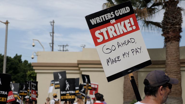 A person holds a sign on the picket line of the writers&#39; strike in Hollywood.