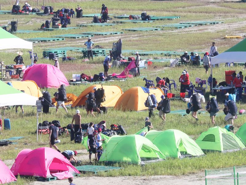 Thousands of scouts are evacuated from World Jamboree site as typhoon  approaches.