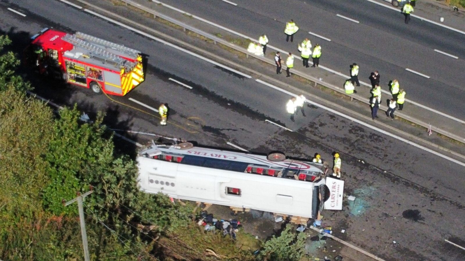 Merseyside: Girl, 14, and driver killed after school bus overturns on motorway