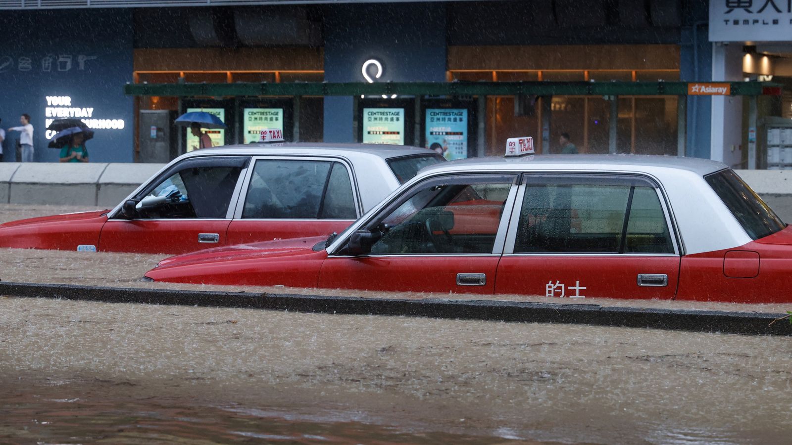 Two dead after Hong Kong flooded by heaviest rainfall in almost 140 ...