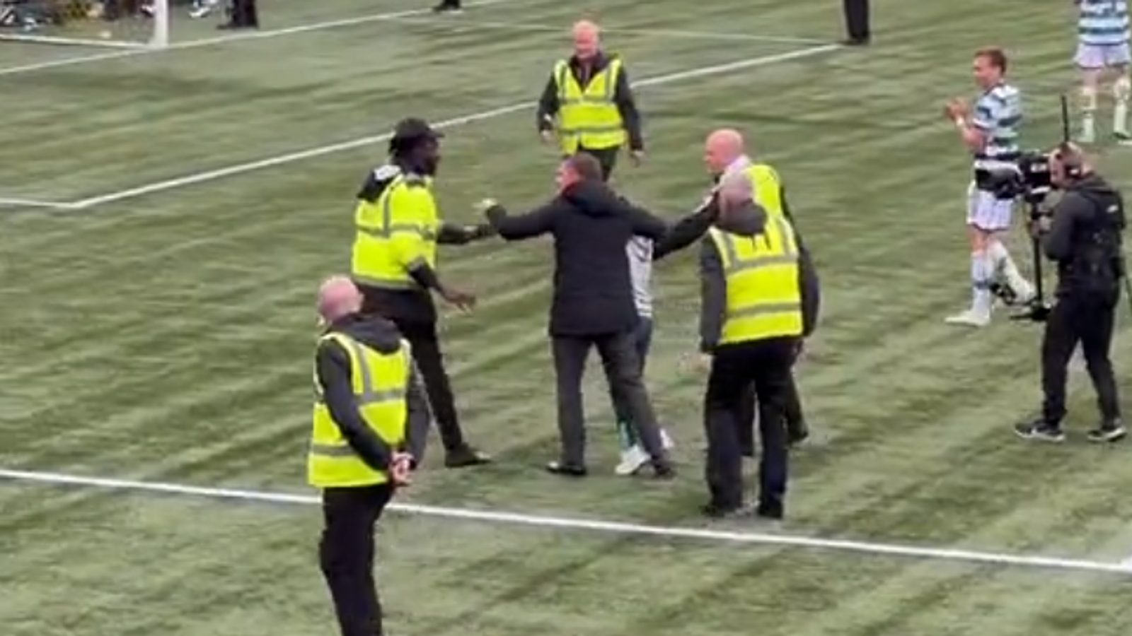 Brendan Rodgers pushes back steward after he knocked Celtic fan to the floor