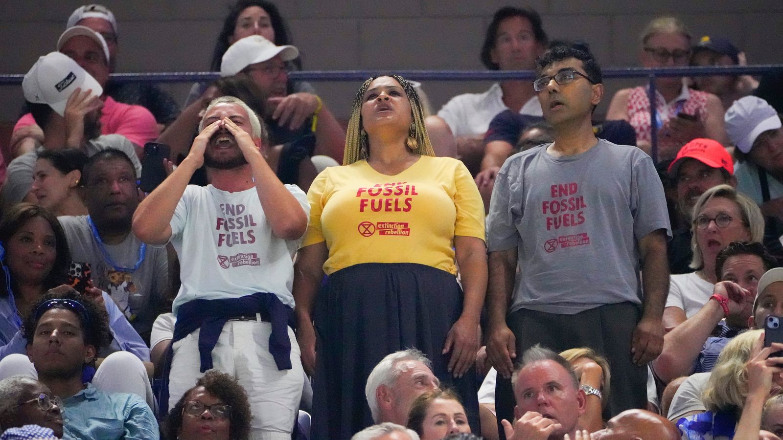 US Open: Climate activists interrupt women’s semi-final and glue their shoes to the ground
