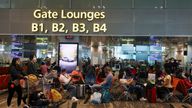 Travellers sit as they wait to embark at the Changi Airport in Singapore March 30, 2022. Picture taken March 30, 2022. REUTERS/Edgar Su