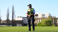 A police officer stands guard near a crime scene at the Australian National University 
Pic:EPA-EFE/Shutterstock