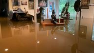A basement in a house in Scarsdale, New York goes under water after torrential rains. Pic: STRF/STAR 