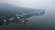 An aerial view shows the smog enveloping the coastal town of Talisay in Batangas Province, Philippines