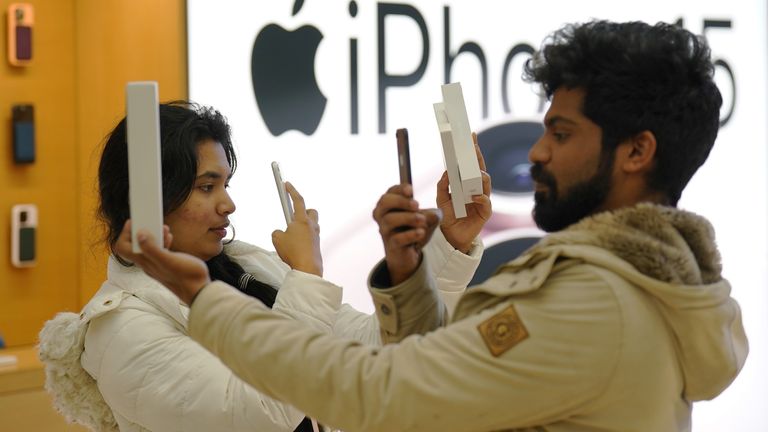 Customers photograph themselves with the new Apple iPhone 15 at the tech giant's flagship store in Regent Street, central London. Picture date: Friday September 22, 2023.
