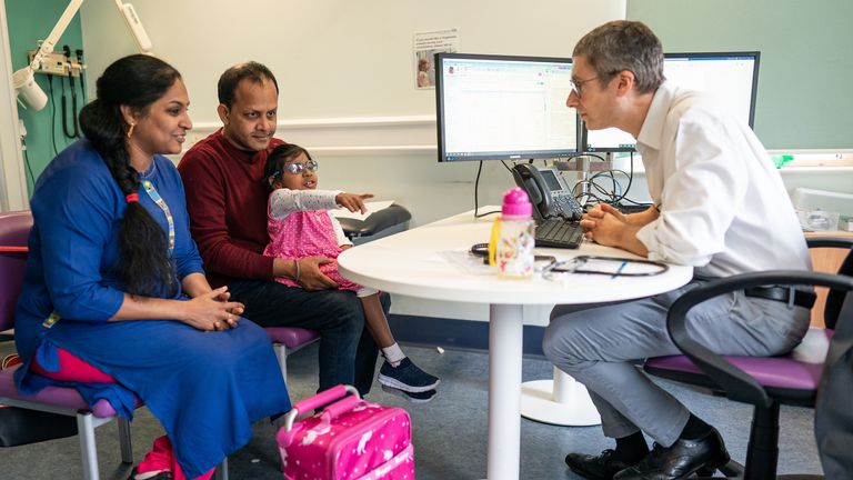 Aditi with her parents and Professor Stephen Marks