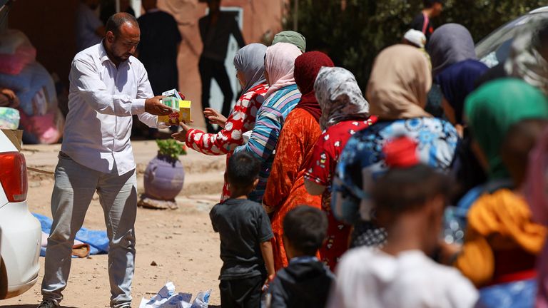 Women and children queue for aid, in the aftermath of a deadly earthquake, in Tinmel, Morocco, September 11, 2023. REUTERS/Hannah McKay
