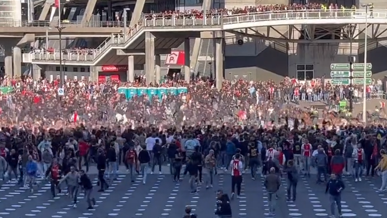 Ajax vs Feyenoord abandoned after flares thrown onto pitch at Johan Cruyff Arena.