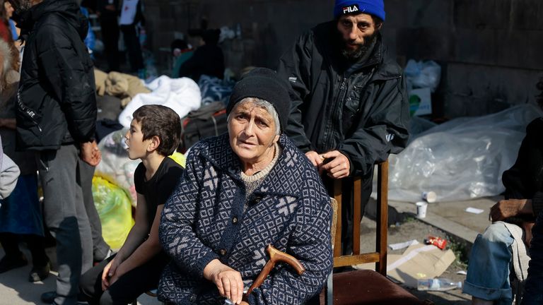 Ethnic Armenians from Nagorno-Karabakh sit next to their belongings near a tent camp after arriving to Armenia&#39;s Goris in Syunik region, Armenia, on Saturday, Sept. 30, 2023. Armenian officials say that by Friday evening over 97,700 people had left Nagorno-Karabakh. The region&#39;s population was around 120,000 before the exodus began. (AP Photo/Vasily Krestyaninov)