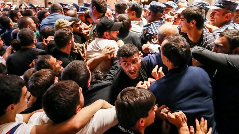 Demonstrators clash with police at the Armenia government building to protest against Prime Minister Nikol Pashinyan in Yerevan, Armenia 
Pic:Photolure /AP