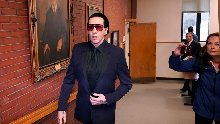 Musical artist Marilyn Manson, whose legal name is Brian Hugh Warner, leaves after appearing in Belknap Superior Court 
Pic:AP