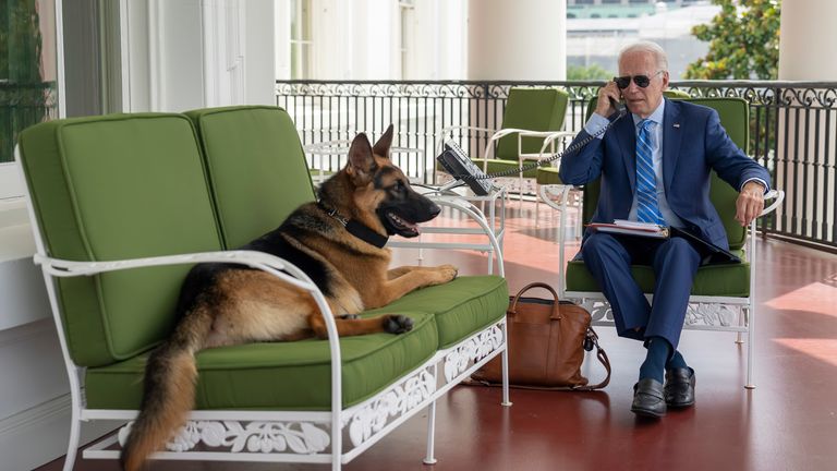 In this image provided by the White House, President Joe Biden speaks on the phone with White House chief of staff Ron Klain from the Truman Balcony, Monday, July 25, 2022, at the White House in Washington. Mandatory credit: Adam Schultz, AP