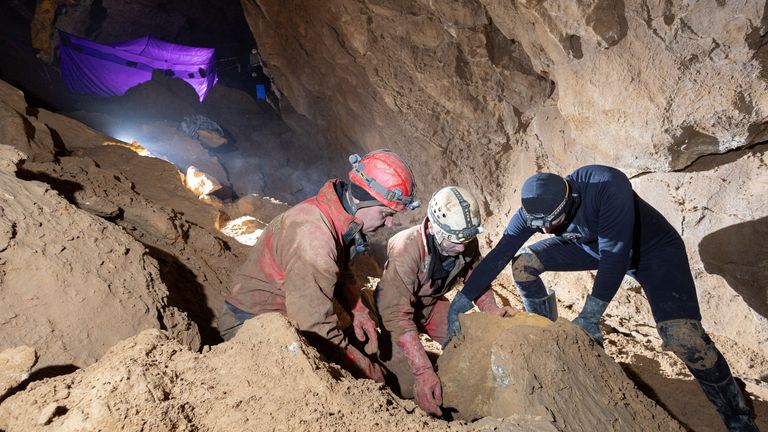Rescuers try to move a rock in Morca Cave, as they take part in a rescue operation to reach U.S. caver Mark Dickey who fell ill and became trapped some 1,000 meters (3,280 ft) underground, near Anamur in Mersin province, southern Turkey September 5, 2023. REUTERS/Agnes Berentes NO RESALES. NO ARCHIVES