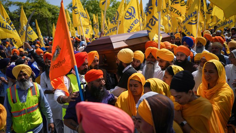 Mourners carry the coffin of Sikh community leader and temple president Hardeep Singh Nijjar during Antim Darshan, the first part of a day-long funeral service for him, in Surrey, Britsih Columbia
Pic:The Canadian Press/AP
