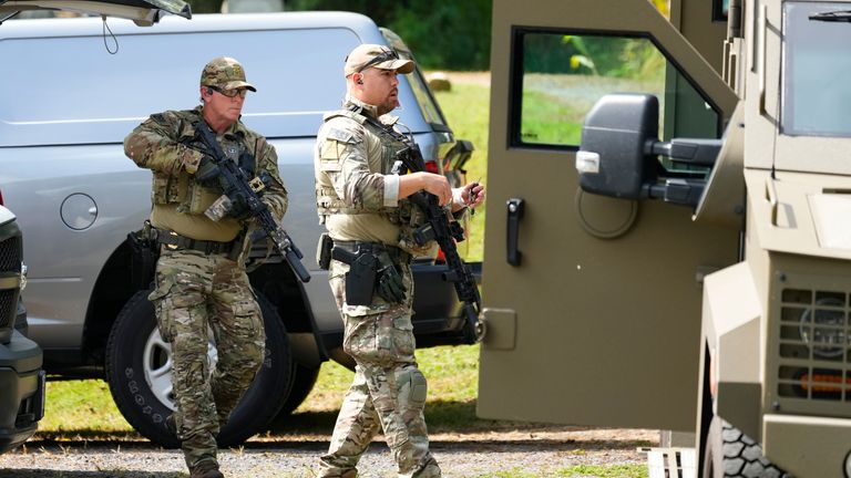 Law enforcement officers gather as they search for escaped convict Danelo Cavalcante in Glenmoore, Pa., Monday, Sept. 11, 2023. (AP Photo/Matt Rourke)