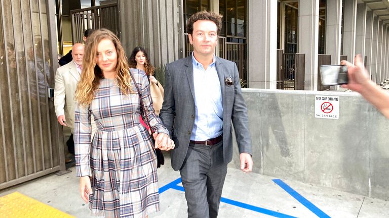 Actor Danny Masterson leaves Los Angeles superior Court with his wife Bijou Phillips after a judge declared a mistrial in his rape case in Los Angeles on Wednesday, Nov. 30, 2022. Jurors said they were hopelessly deadlocked at the trial of "That &#39;70s Show" actor who was charged with the rape of three women, including a former girlfriend, between 2001 and 2003. (AP Photo/Brian Melley)