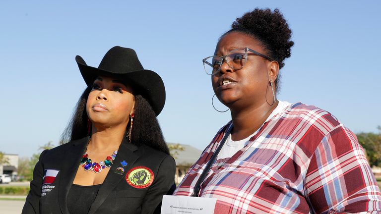 Advocate Dr. Candice Matthews, left, National Minister of Politics for The New Black Panther Nation, and Darresha George, right, mother of Darryl George, a 17-year-old junior, talks with reporters after meeting with school officials after Darryl received another one-day suspension at Barbers Hill High School, after he returned after serving a 5-day in-school suspension for not cutting his hair Monday, Sept. 18, 2023, in Mont Belvieu. (AP Photo/Michael Wyke)