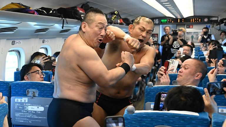  DDT Pro-Wrestling wrestlers fight inside Tokaido Shinkansen bullet train in Japan
Pic: JR Tokai/Reuters
