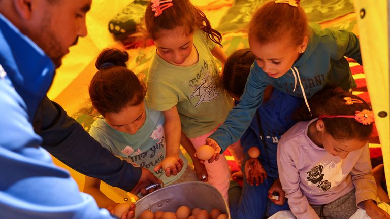 Children receive food, in the aftermath of a deadly earthquake, in Adassil, Morocco, September 11, 2023. REUTERS/Nacho Doce
