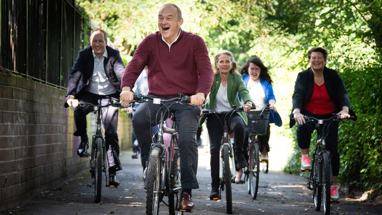 Sir Ed Davey alongside West Country MPs and key candidates as they arrive by bicycle for the Liberal Democrat conference in Bournemouth
