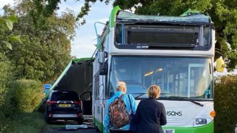 Two children have been taken to hospital after a bus had its roof ripped off during a crash with a car in Essex.