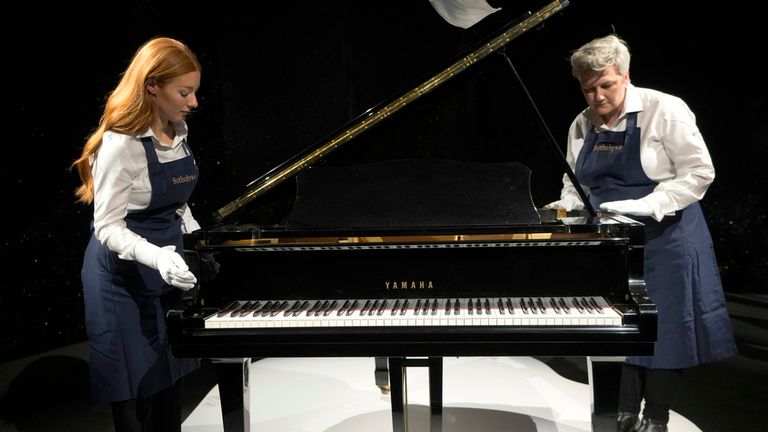 Freddie Mercury&#39;s Yamaha Grand Piano, estimated at 2-3 million pounds, on display at Sotheby&#39;s auction rooms in London, Thursday, Aug. 3, 2023. More than 1,000 of Freddie Mercury&#39;s personal items, including his flamboyant stage costumes, handwritten drafts of ...Bohemian Rhapsody... and the baby grand piano he used to compose Queen&#39;s greatest hits, are going on show in an exhibition at Sotheby&#39;s London ahead of their sale. (AP Photo/Kirsty Wigglesworth)