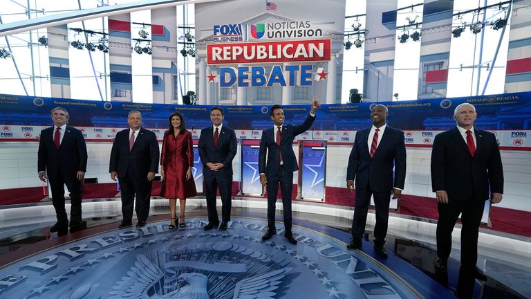 Republican presidential candidates, from left, North Dakota Gov. Doug Burgum, former New Jersey Gov. Chris Christie, former U.N. Ambassador Nikki Haley, Florida Gov. Ron DeSantis, entrepreneur Vivek Ramaswamy, Sen. Tim Scott, R-S.C., and former Vice President Mike Pence, stand together during a Republican presidential primary debate hosted by FOX Business Network and Univision, Wednesday, Sept. 27, 2023, at the Ronald Reagan Presidential Library in Simi Valley, Calif. (AP Photo/Mark J. Terrill)
