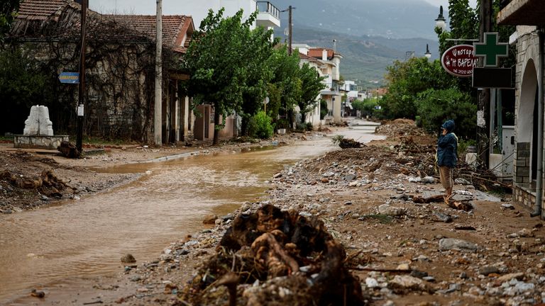 A woman looks at the destruction after torrential rains destroyed the infrastructure and caused flooding in the area, in Agria, central Greece September 6, 2023. REUTERS/Louisa Gouliamaki