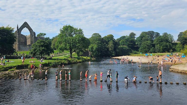 People enjoying the sunshine at Bolton Abbey in Yorkshire, as temperatures hit 30C for the fifth day in a row, the first time that&#39;s happened in September since records began