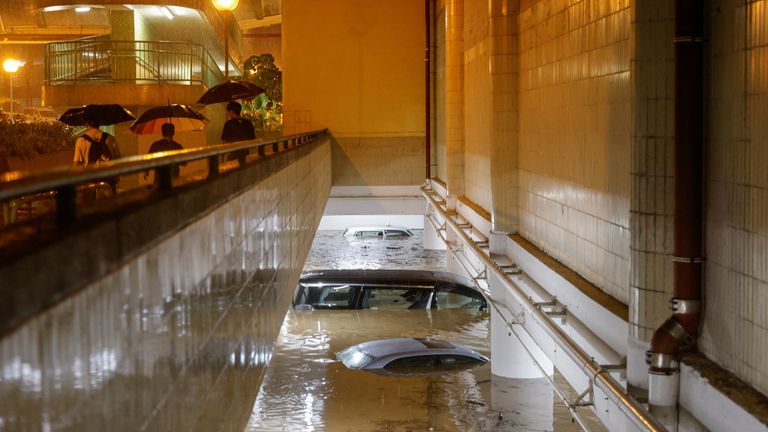 Vehicles in a  flooded car park